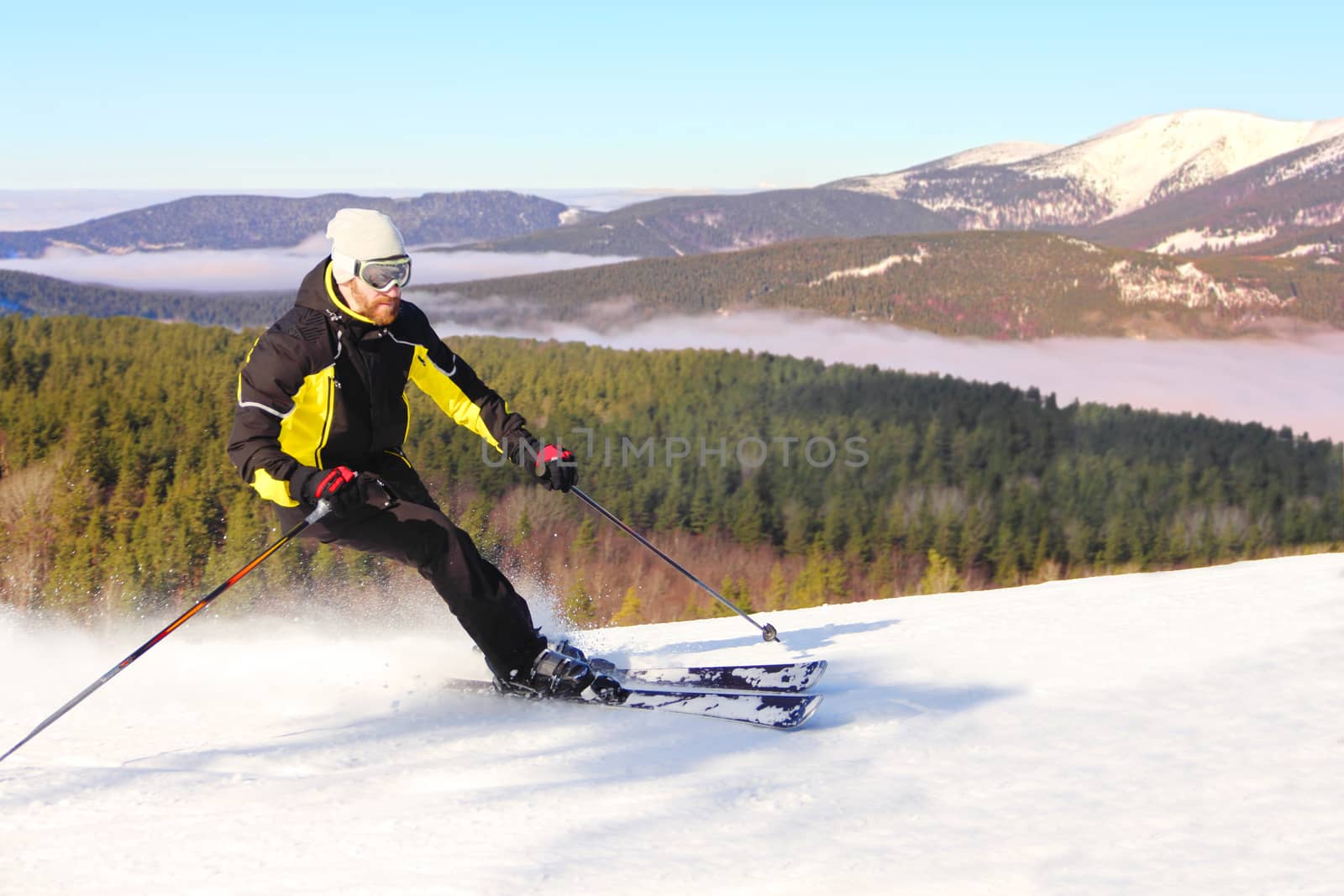Skier in morning mountains by destillat