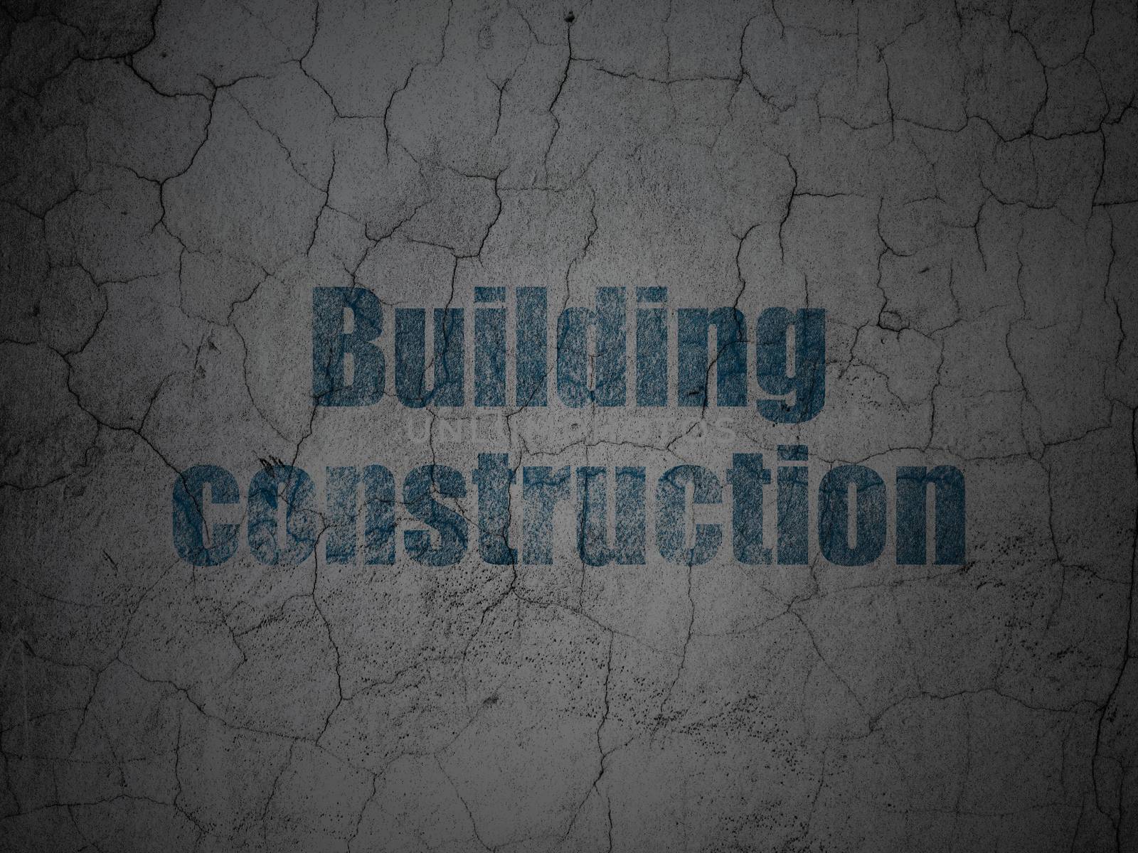 Constructing concept: Blue Building Construction on grunge textured concrete wall background