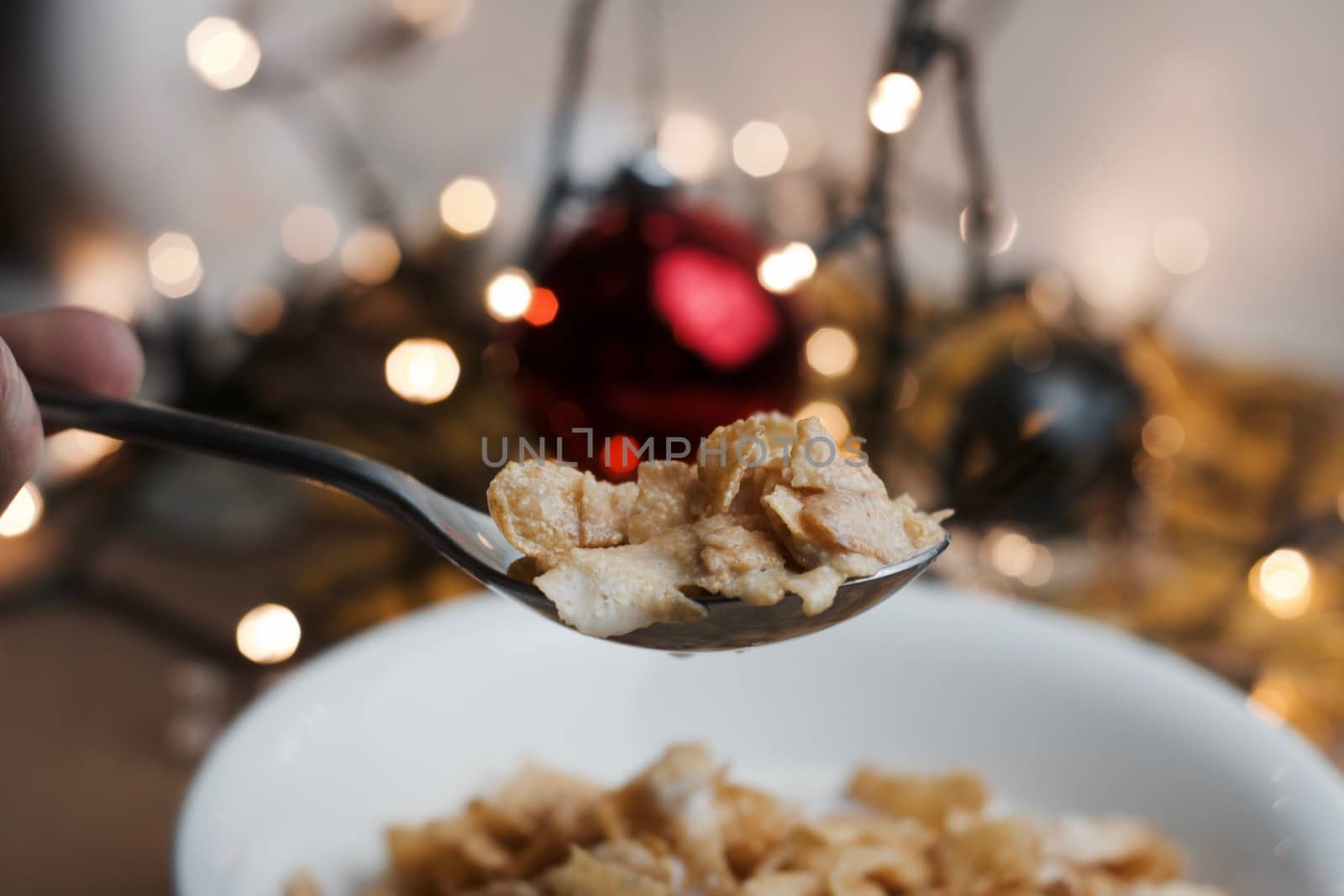 Delicious and fresh corn flakes in white bowl. Christmas food concept.