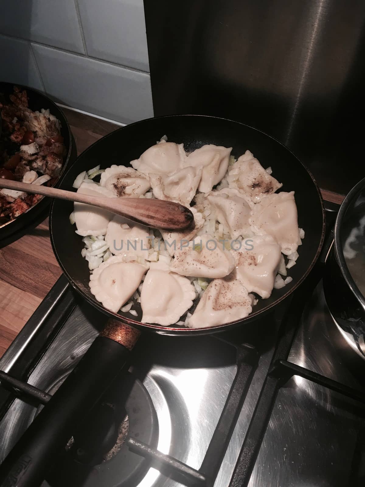 Vegetarian russian dumplings on the pan in the kitchen. Food concept.