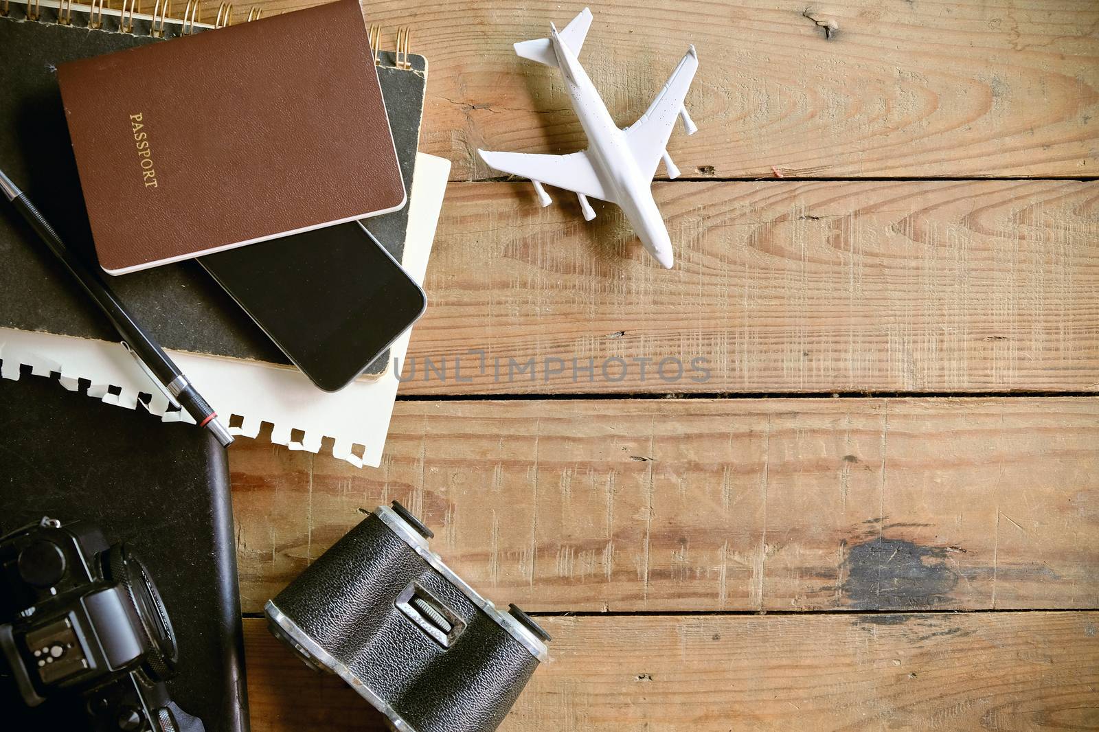 Travel preparations on wooden plank, travel concept background