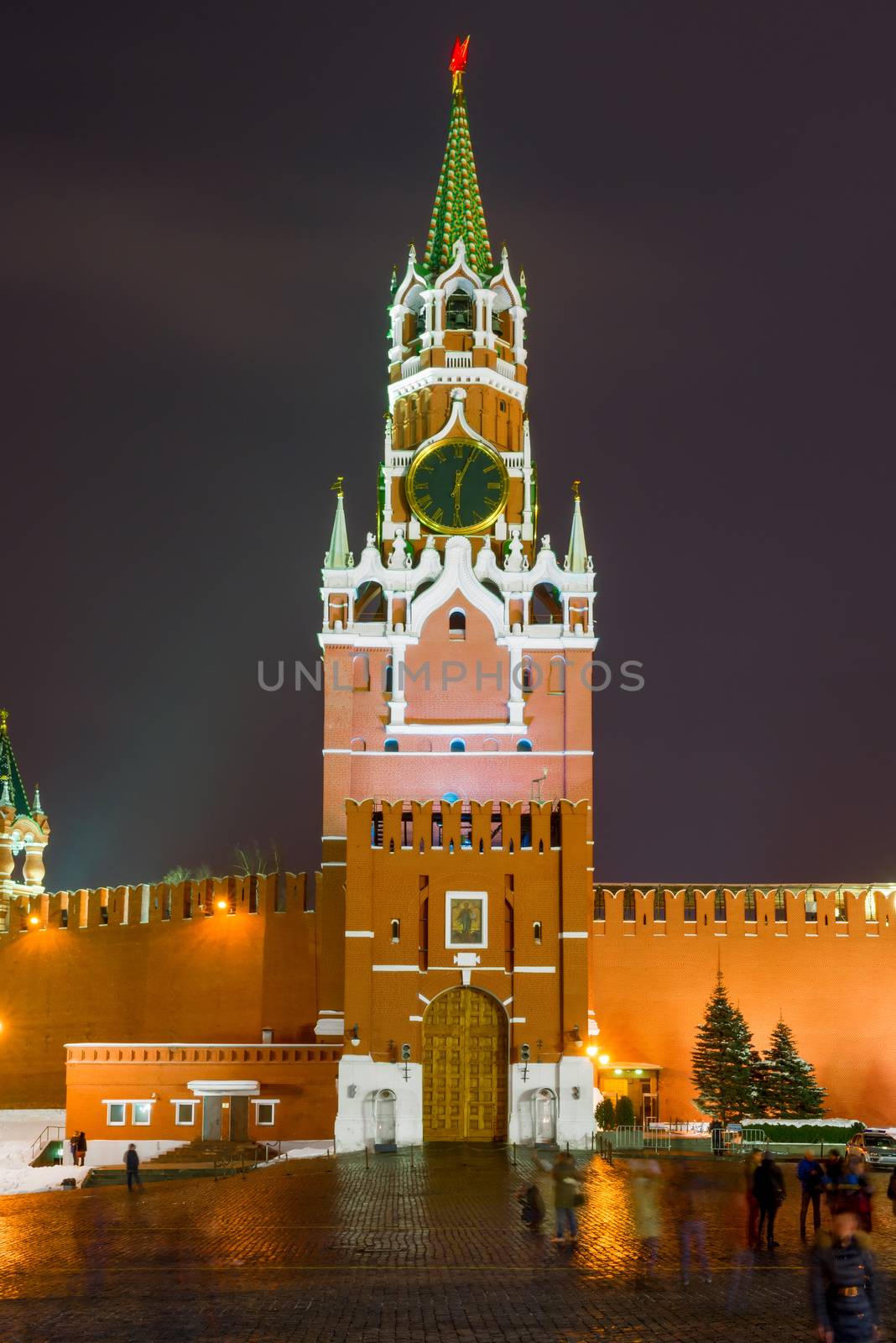 Night photo of the Kremlin's Spassky tower with chiming clock in the winter at night