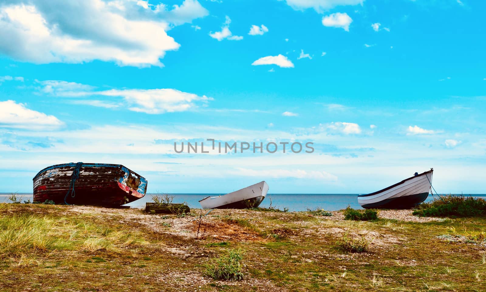 upturned fishing boats on heath near shore