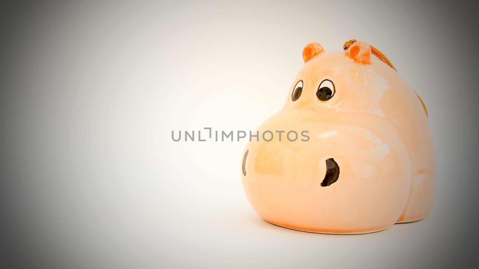 Whimsical Hippopotamus ornament on plain background