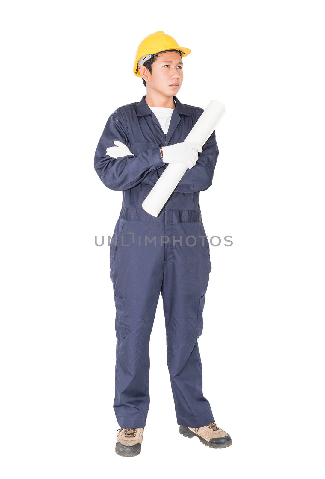 Young worker with yellow helmet holding blueprint isolated over white background