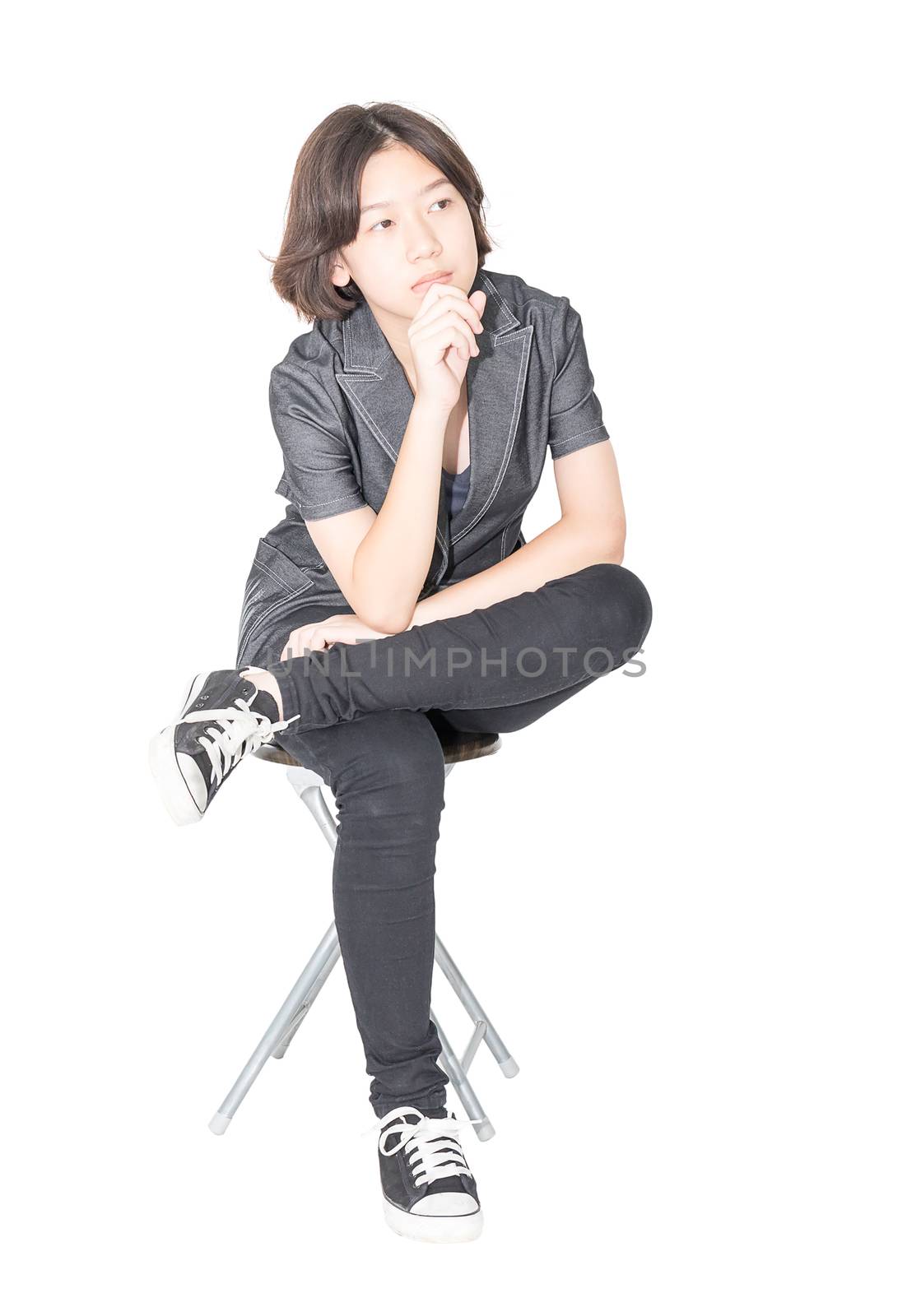 Young women sit on chair over white by stoonn