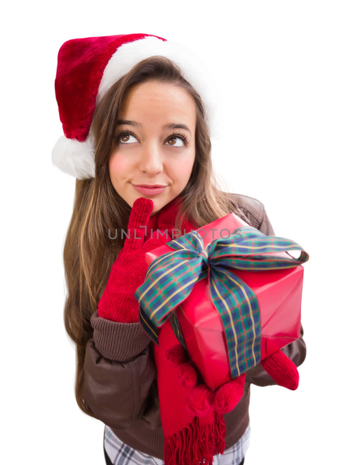 Thinking Girl Wearing A Christmas Santa Hat with Bow Wrapped Gift Isolated on White