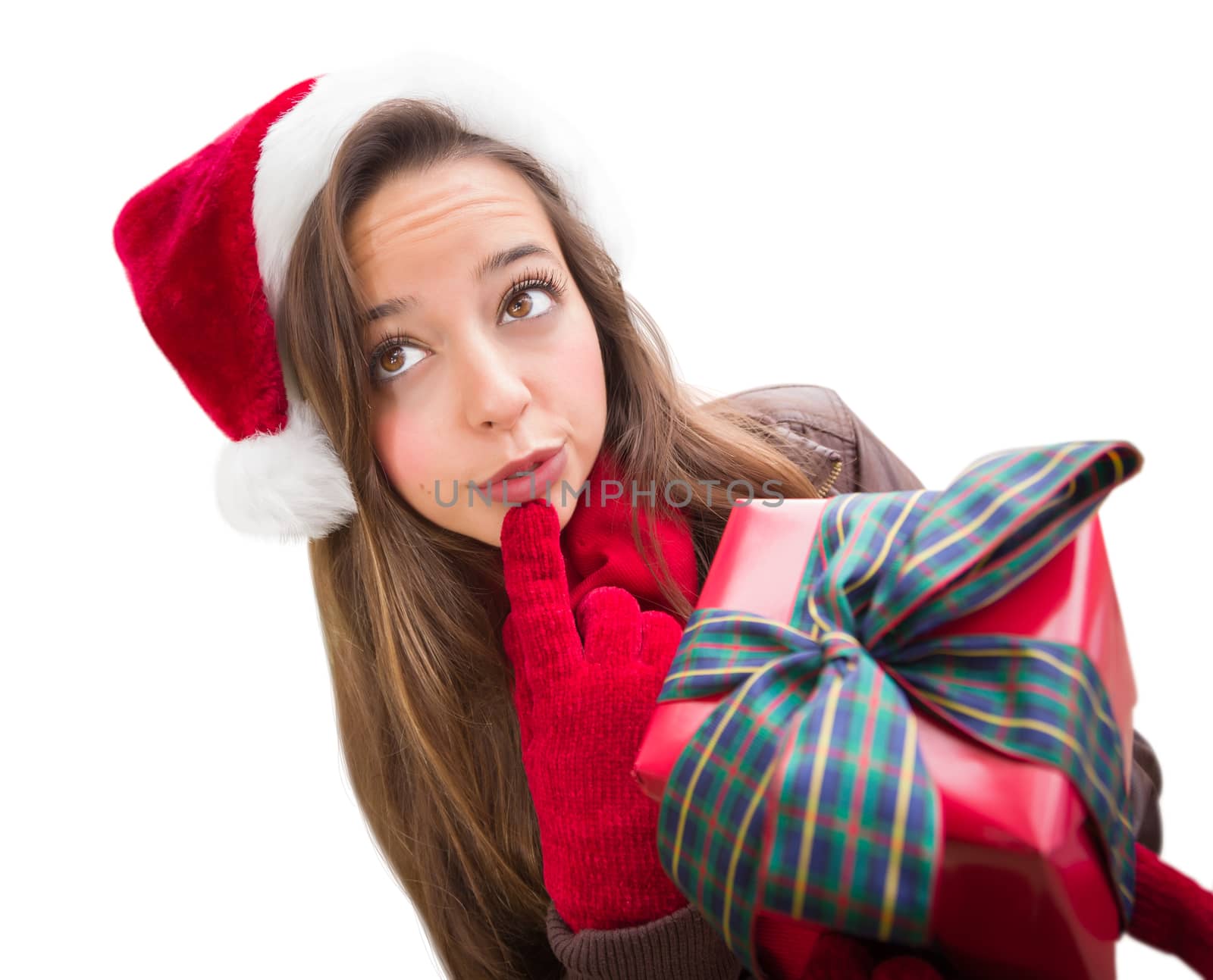 Thinking Girl Wearing A Christmas Santa Hat with Bow Wrapped Gift Isolated on White by Feverpitched