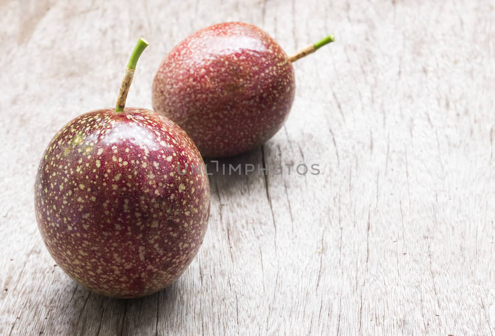 Closeup passion fruit on wooden background, fruit healthy concept