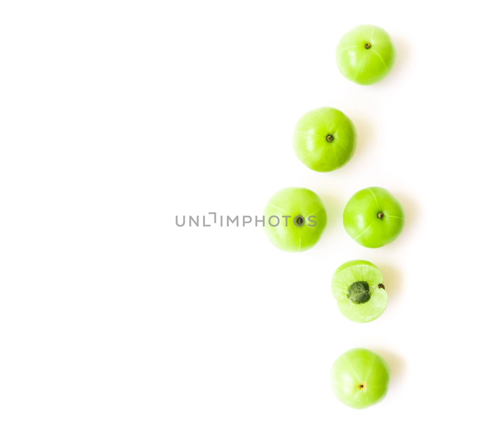 Top view fresh indian gooseberry fruit on white background with high vitamin C, Herb and medical for health concept