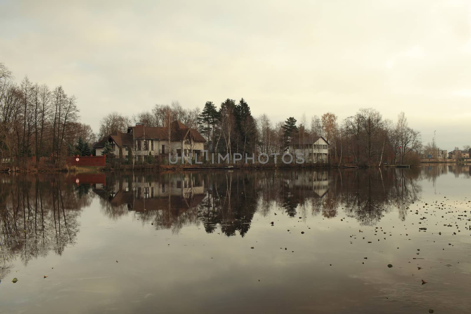 lake first frost as a mirror reflects the beautiful landscape, morning