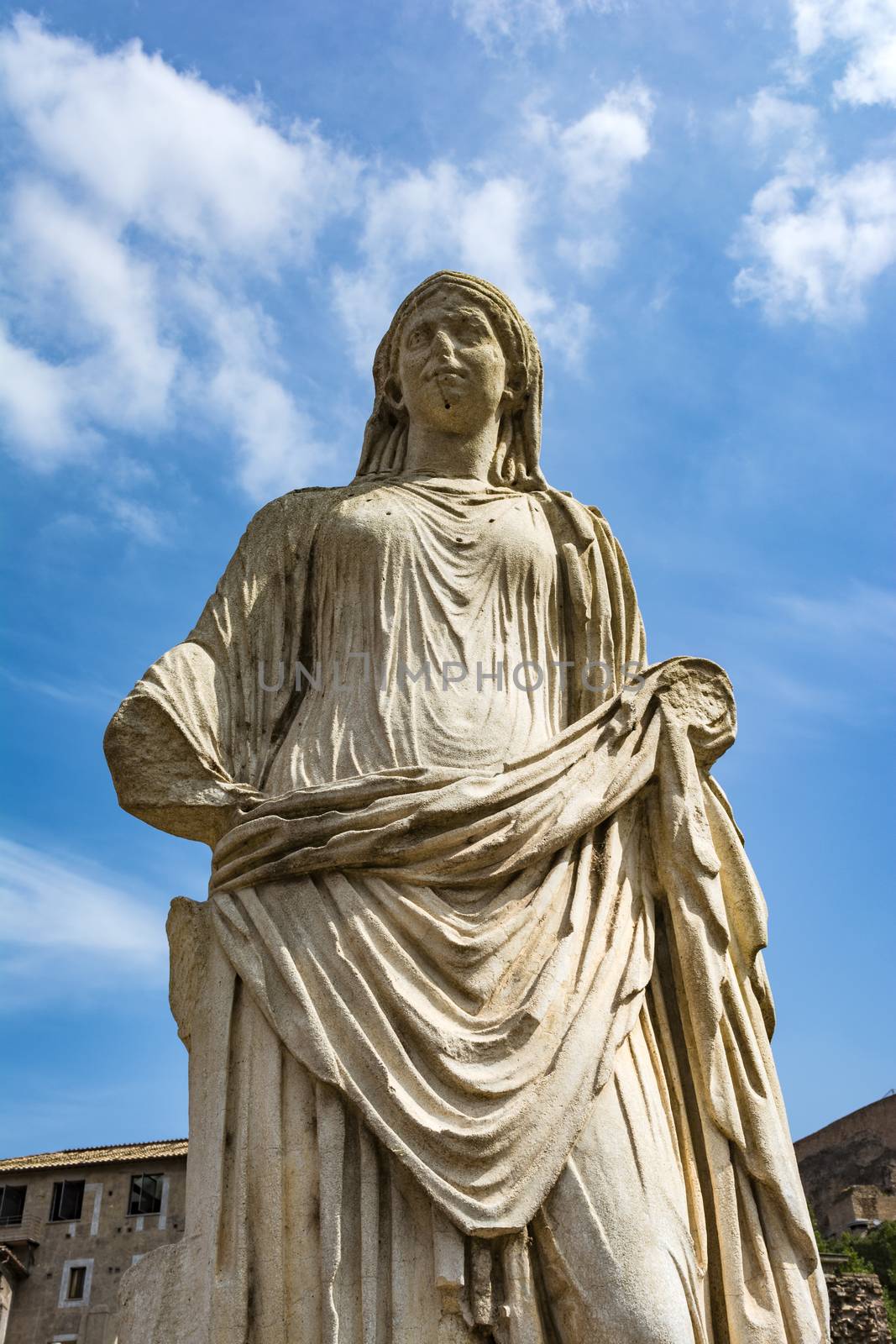 Roman statue at House of the Vestals in Roman Forum , Rome, Italy. The Roman Forum is one of the main tourist attractions of Rome.