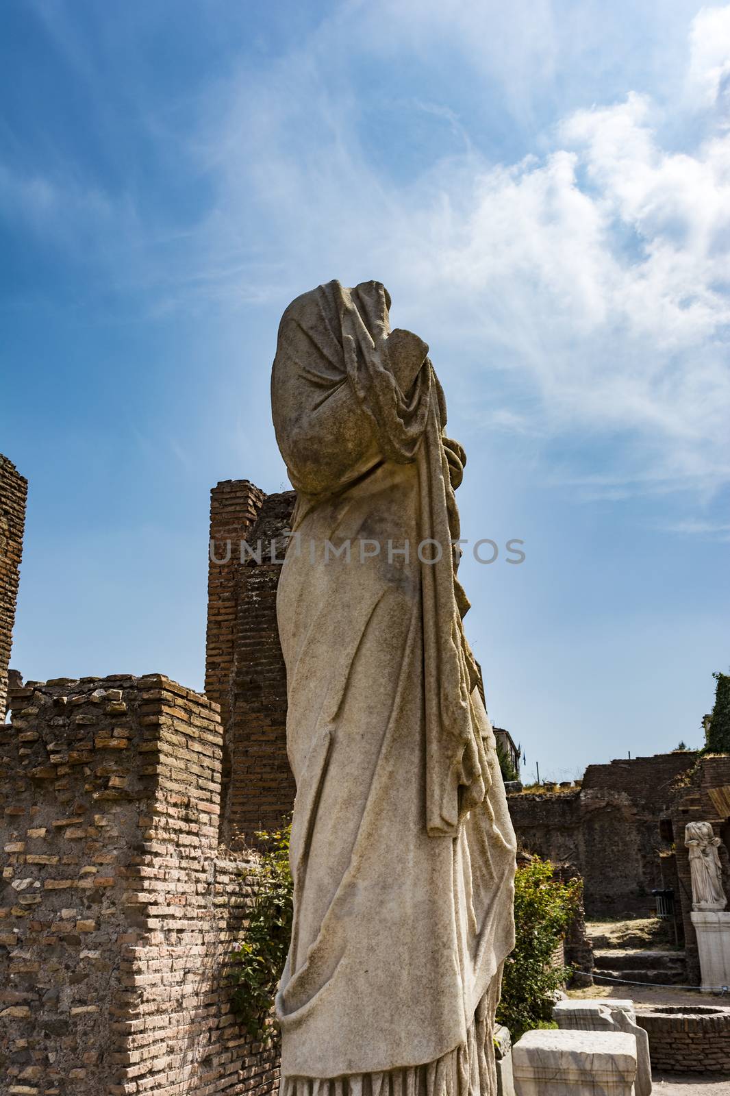 Roman statue at House of the Vestals in Roman Forum , Rome, Italy. by ankarb