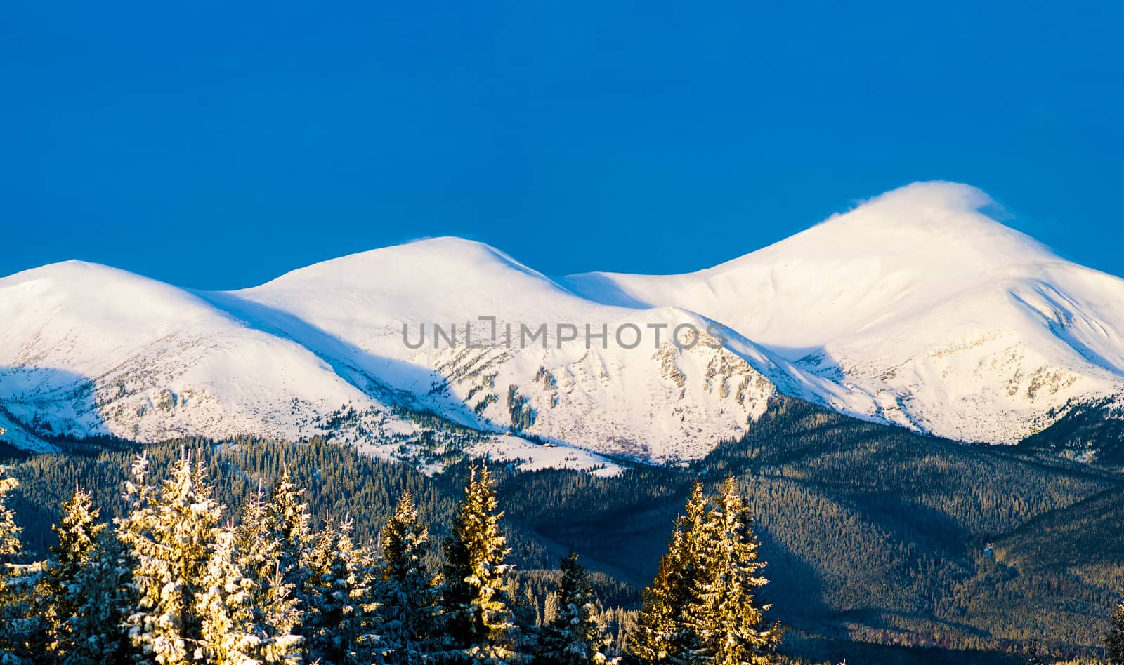 Three mountain peaks in snow by oleksandrmazur