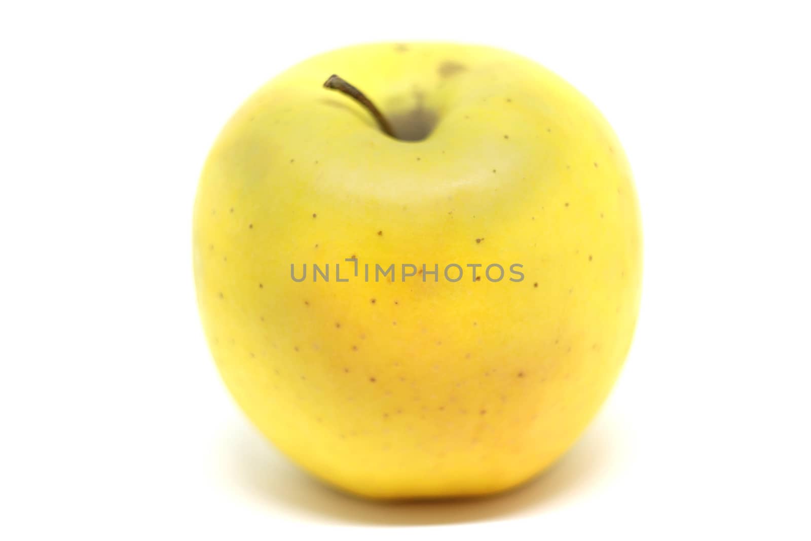 Fresh yellow apple isolated on white background.