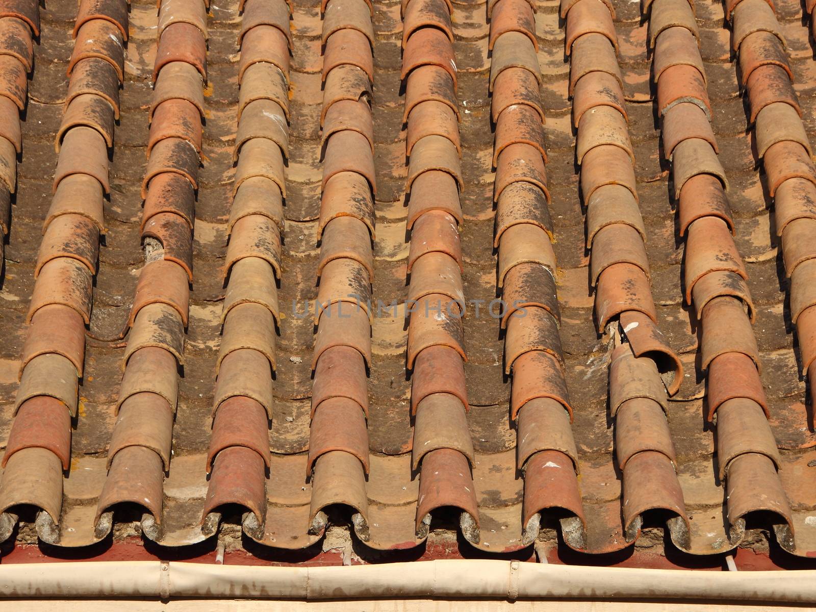 Worn Old Tile Brick Roof with Gutter in Warm Colors by HoleInTheBox
