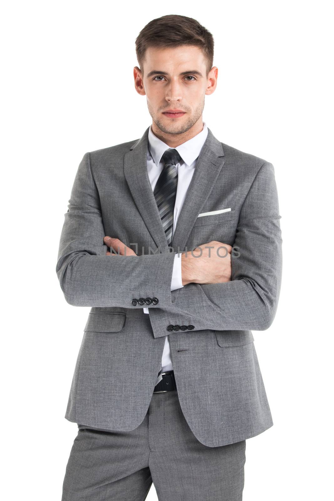 Portrait of a handsome young businessman in suit over white background