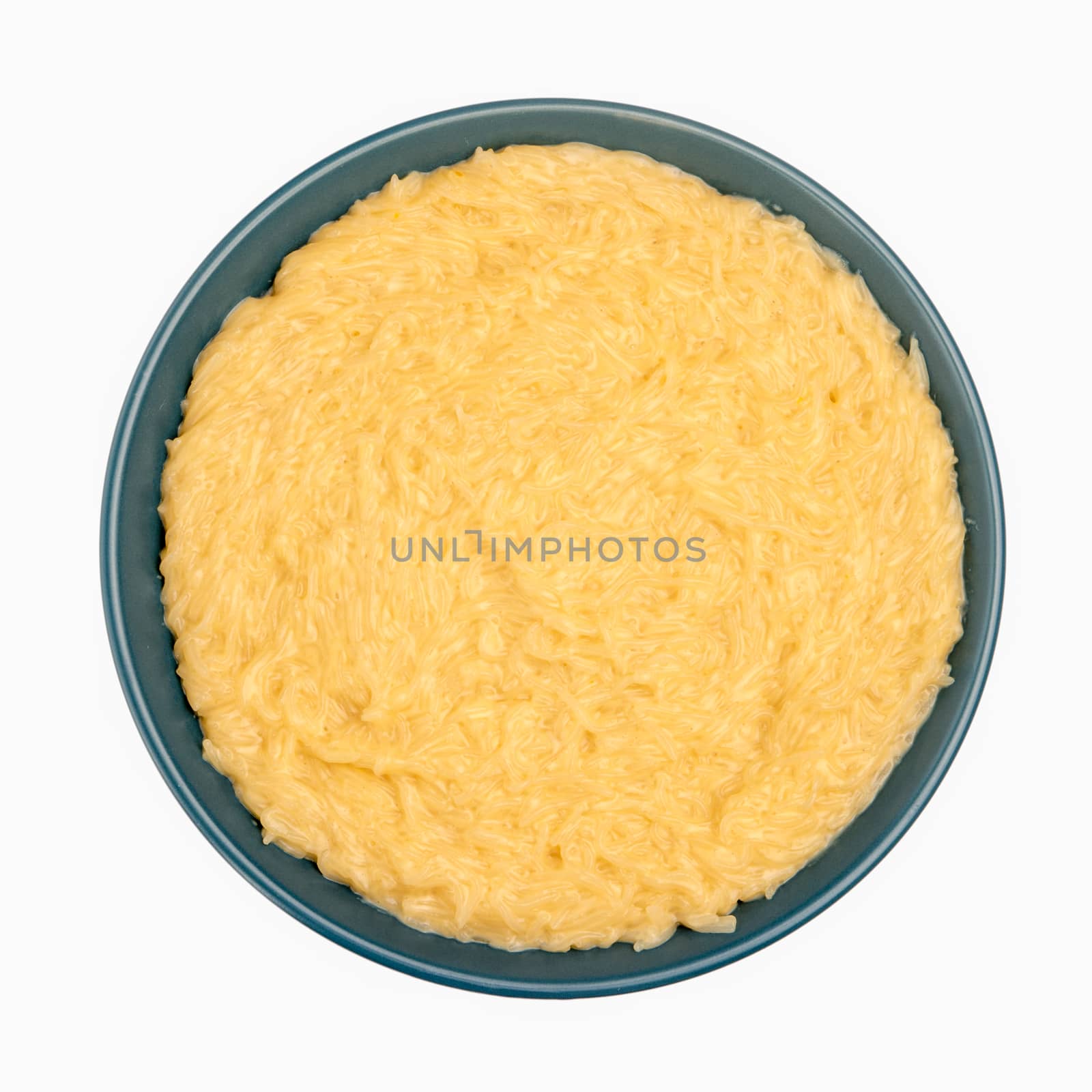 Vermicelli desert on a blue ceramic plate isolated on white background.