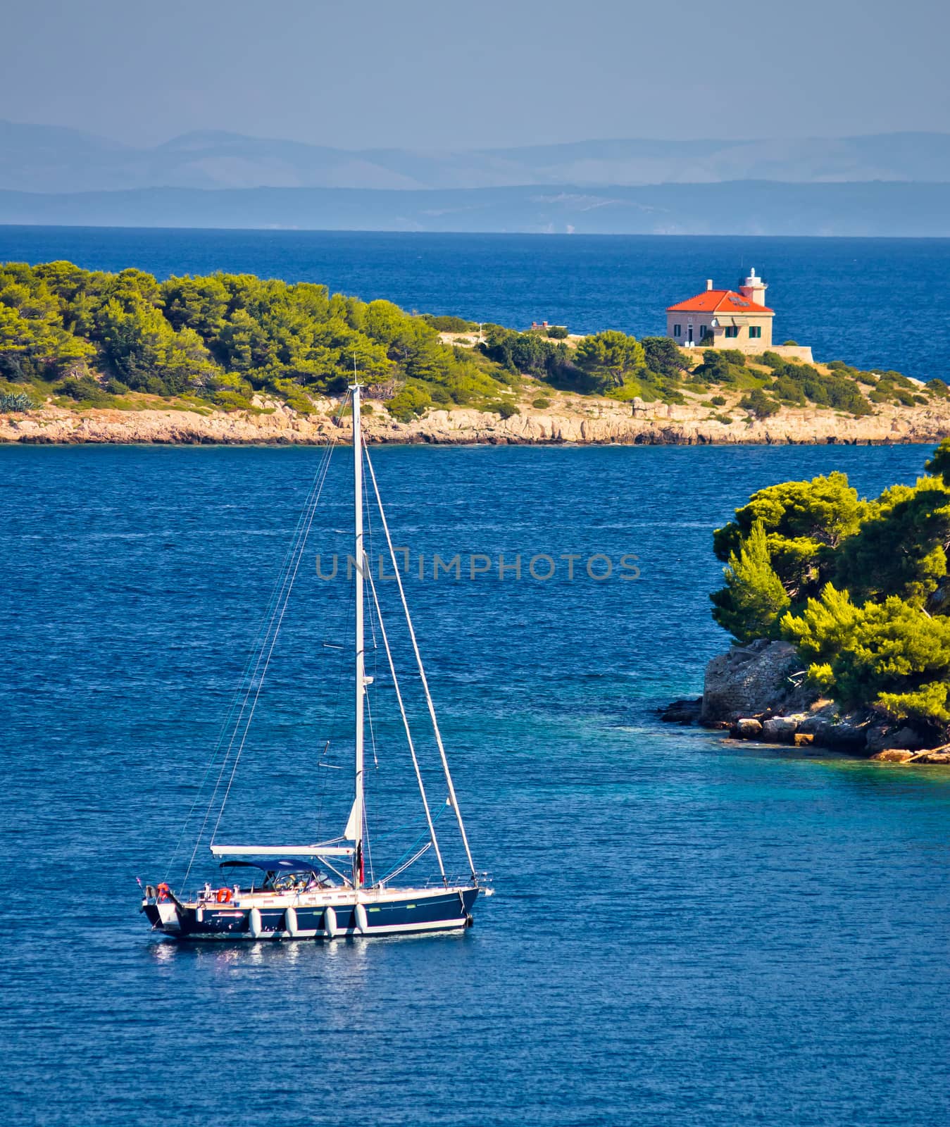 Island of Vis bay entrance and lighthouse view, sailing destination in Dalmatia archipelago of Croatia