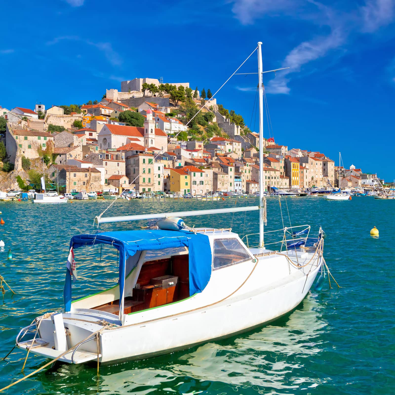 Town of Sibenik turquoise waterfront and boats view by xbrchx