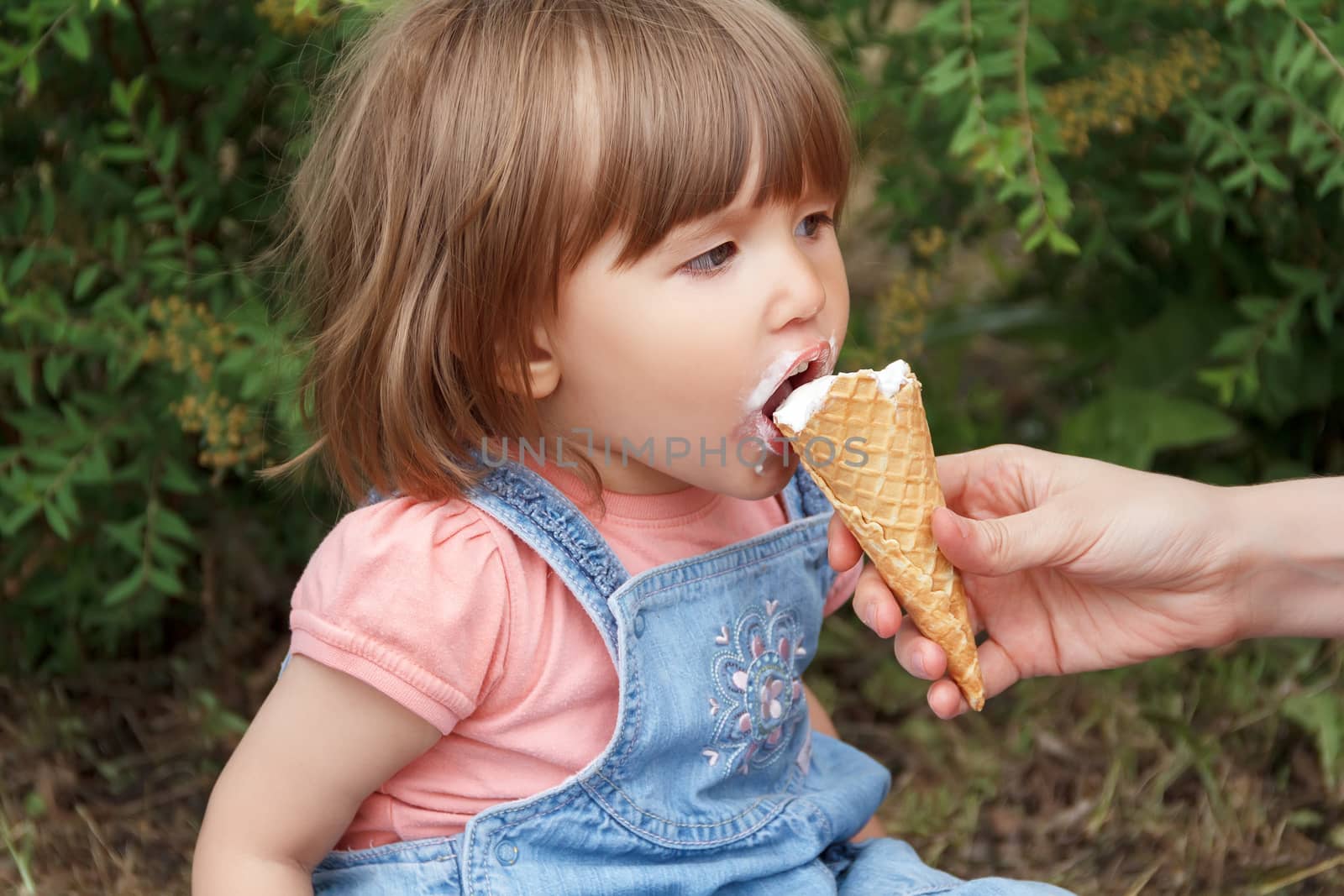 Photo of cute girl are eating icecream in summer