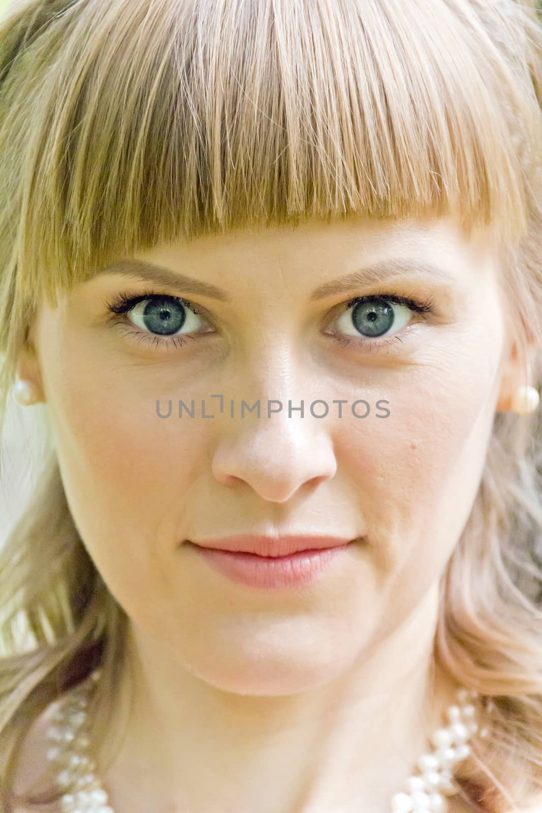 Portrait of beautiful girl with big blue eyes and pink lips
