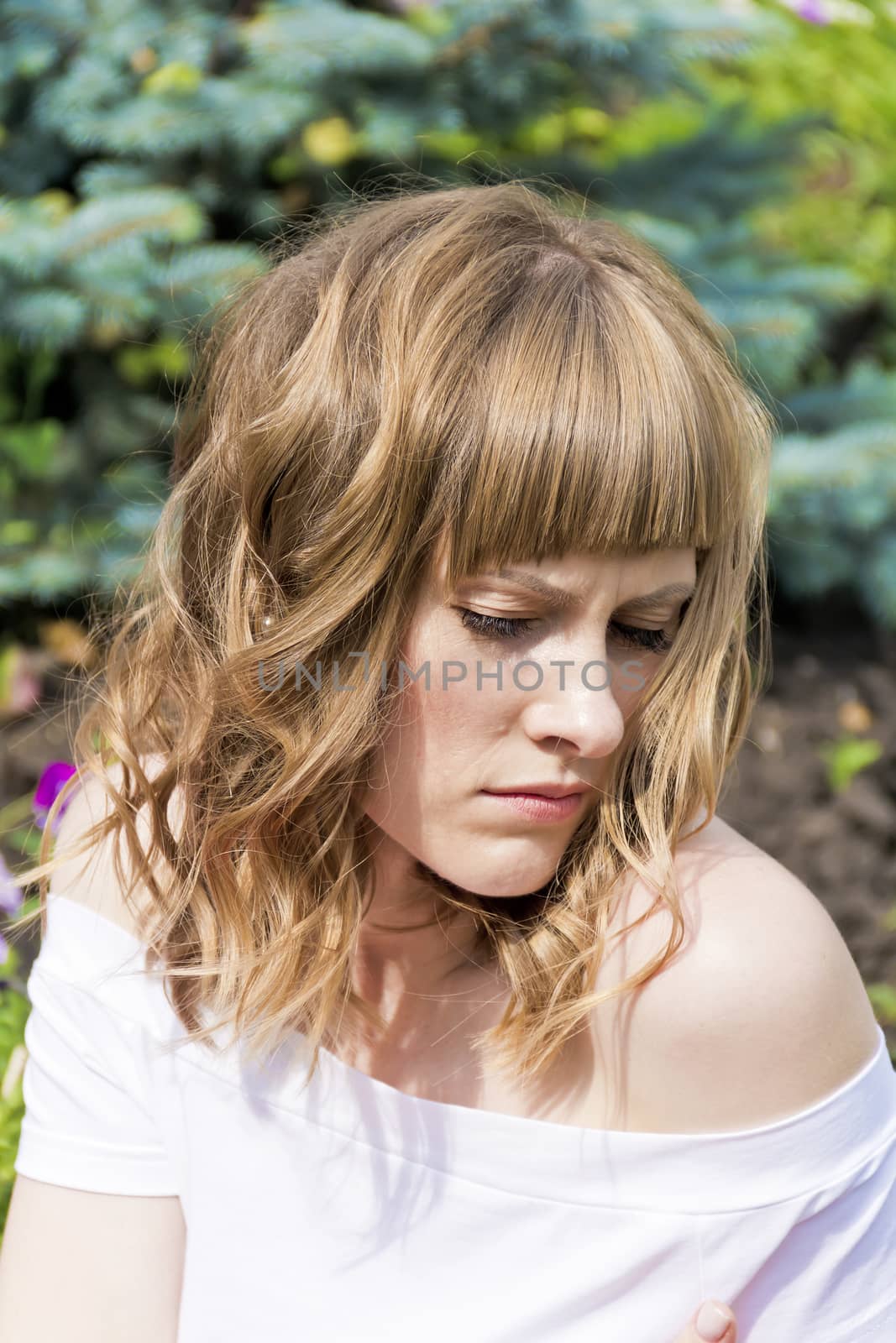 Portrait of young woman with blond hair by Julialine