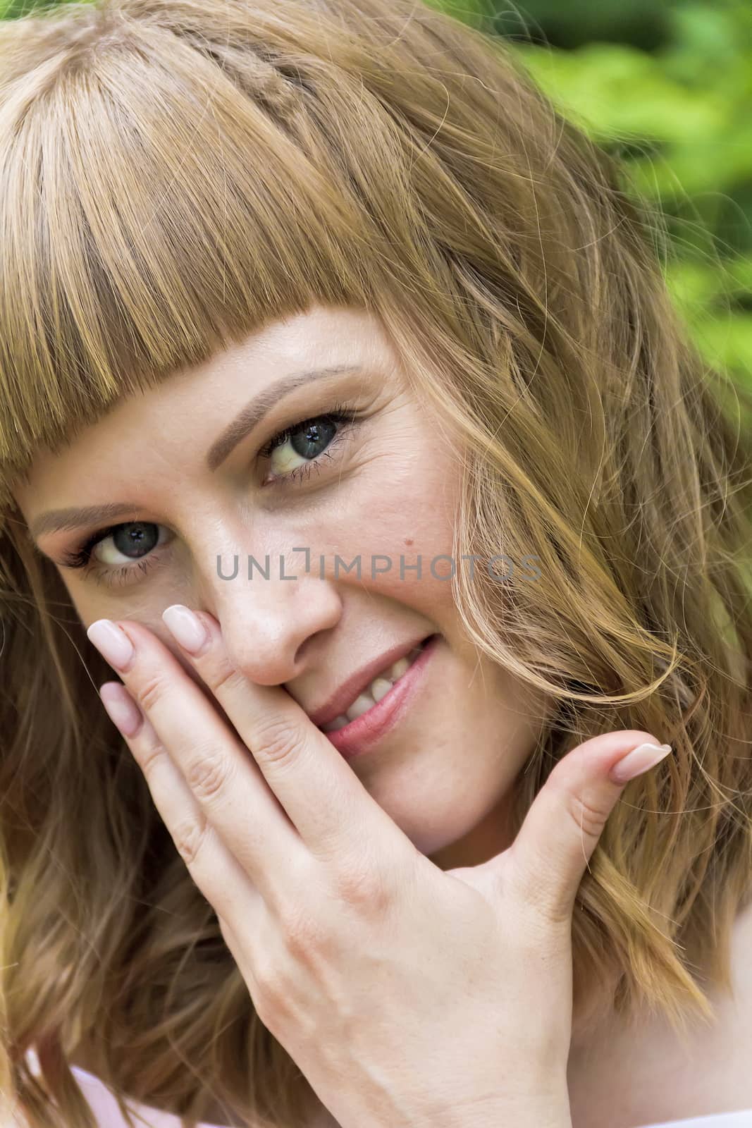 Vertical portrait of young woman with blond hair