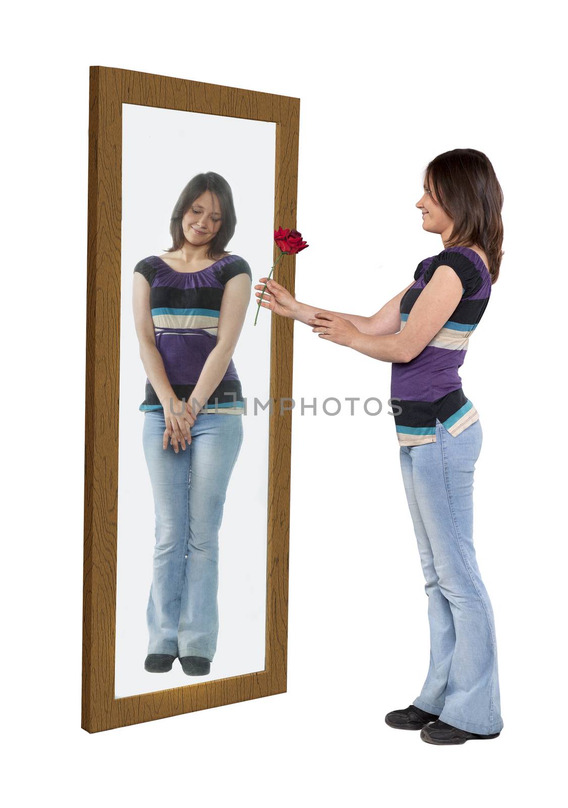 Young woman giving a flower to her reflection in a mirror, concept of self-esteem
