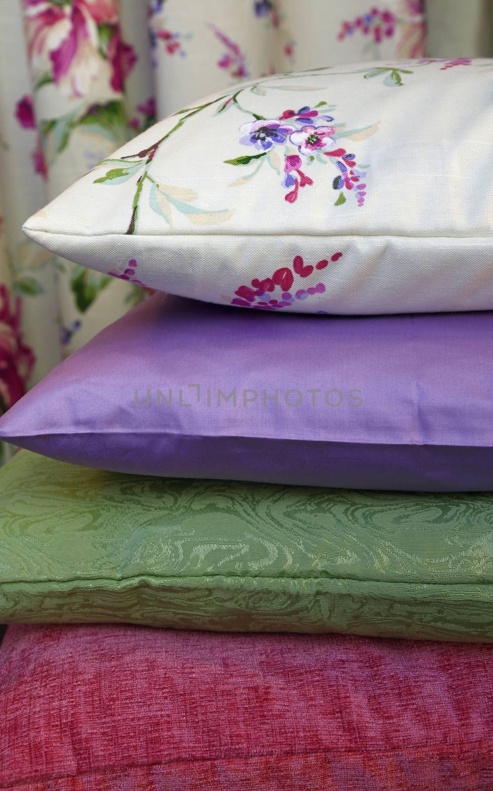 Selection of colorful pillows in retail store, close up, low angle view