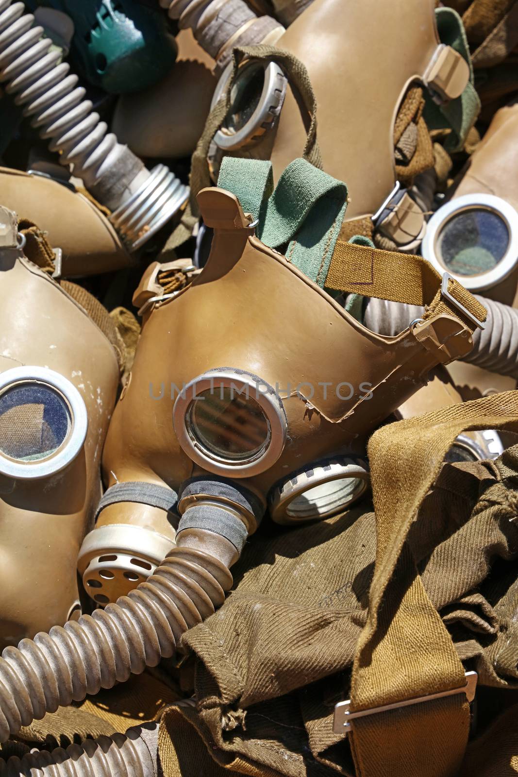 Close up selection of old vintage worn respirator gas masks at retail market stall display