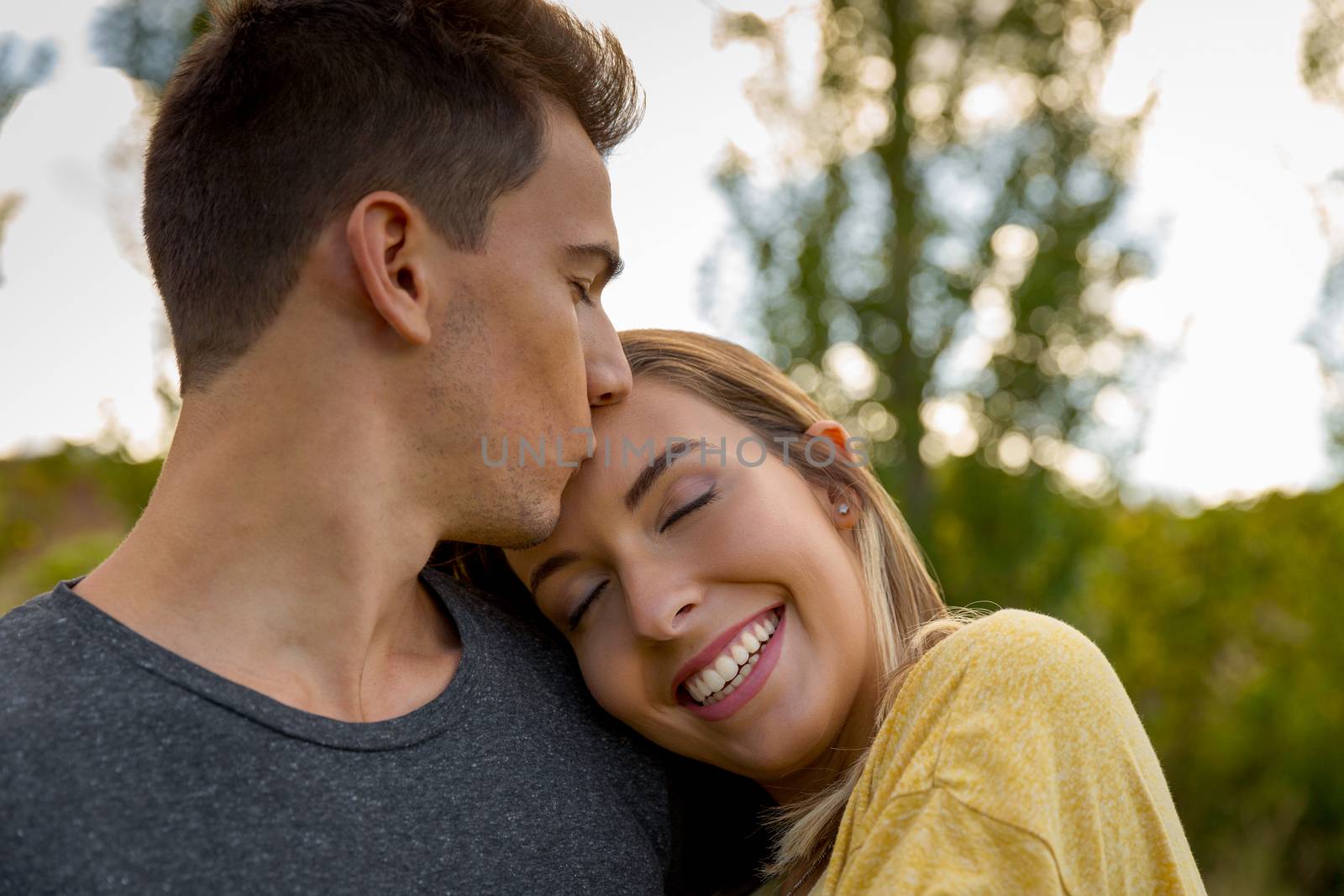 Portrait of a young beautiful couple hugged together