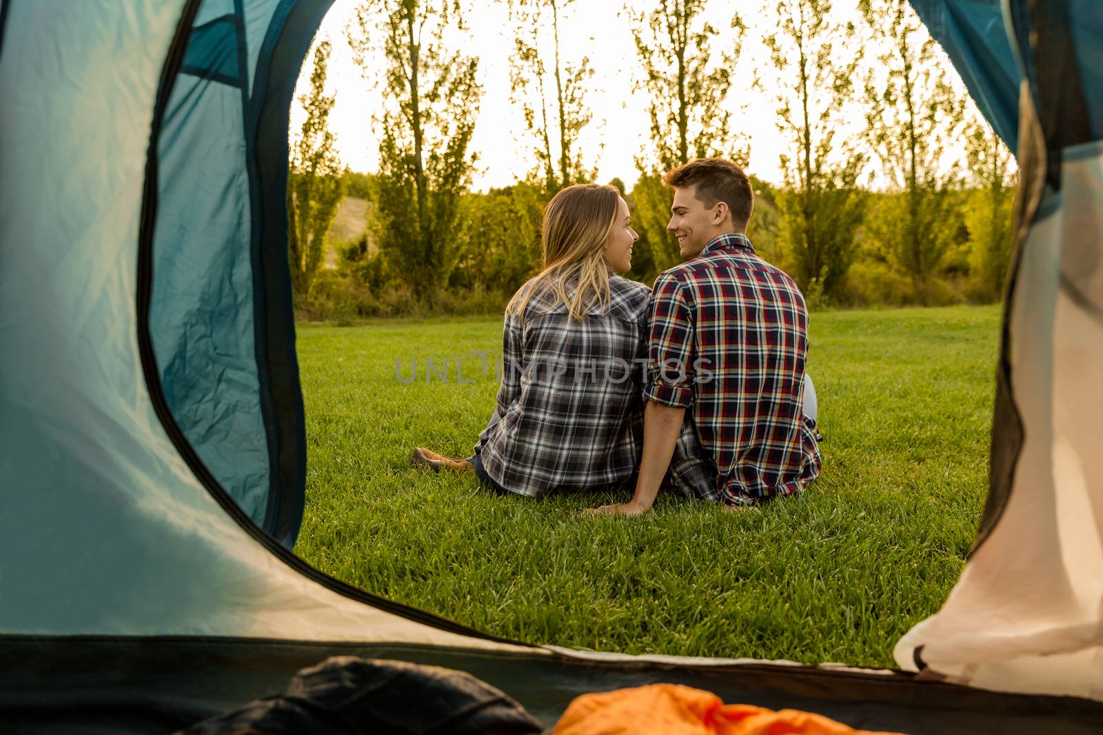 Shot of a happy couple camping on the nature