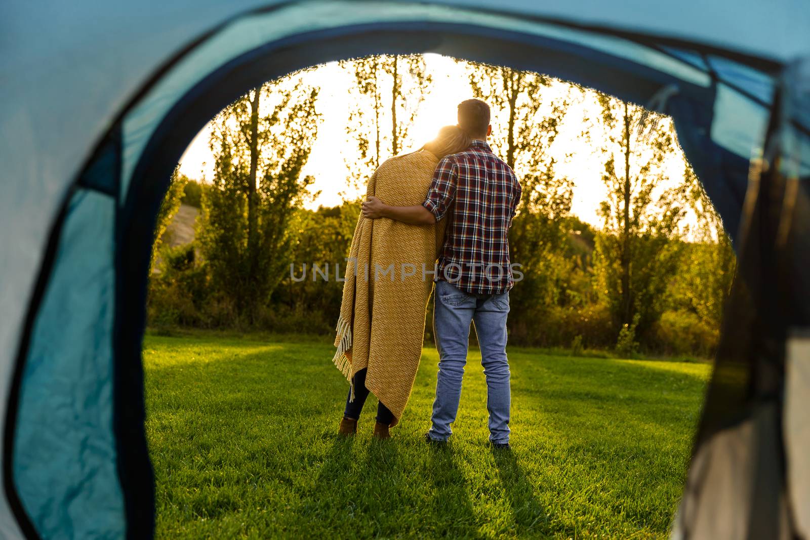 Young couple in love after waking up in the nature