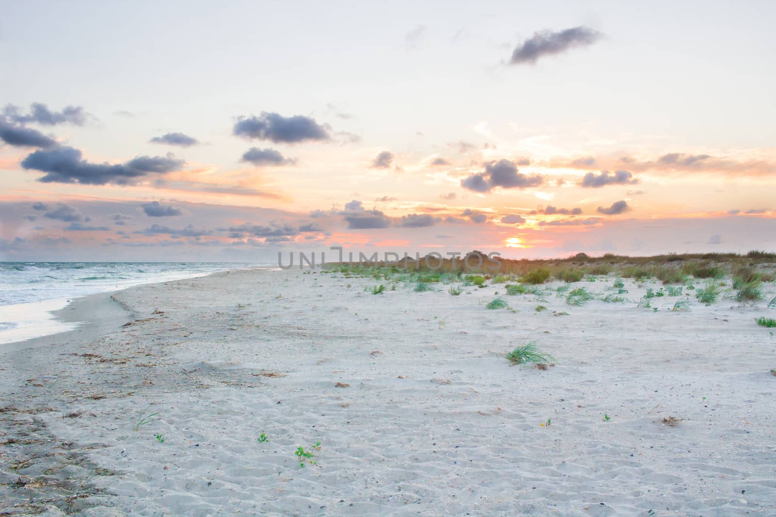 Sandy empty sea coastal seaview, cloudy colourful sunrise sky view