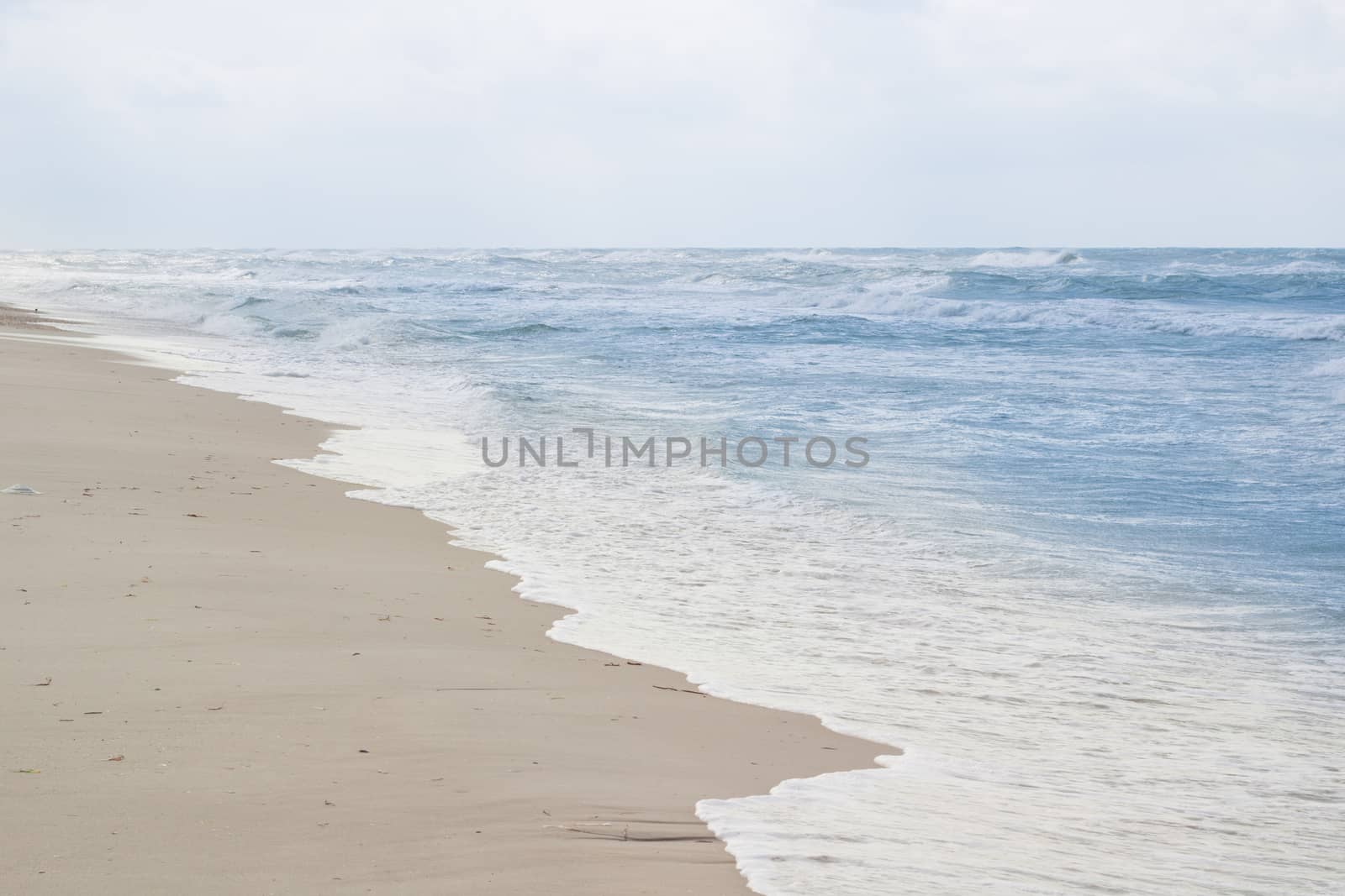 Sandy empty sea coastal seaview, cloudy colourful sunrise sky view