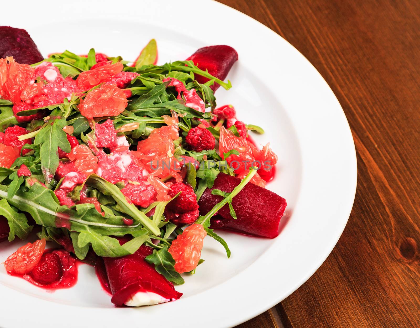 Closeup shot of a plate full of a salad by Nobilior