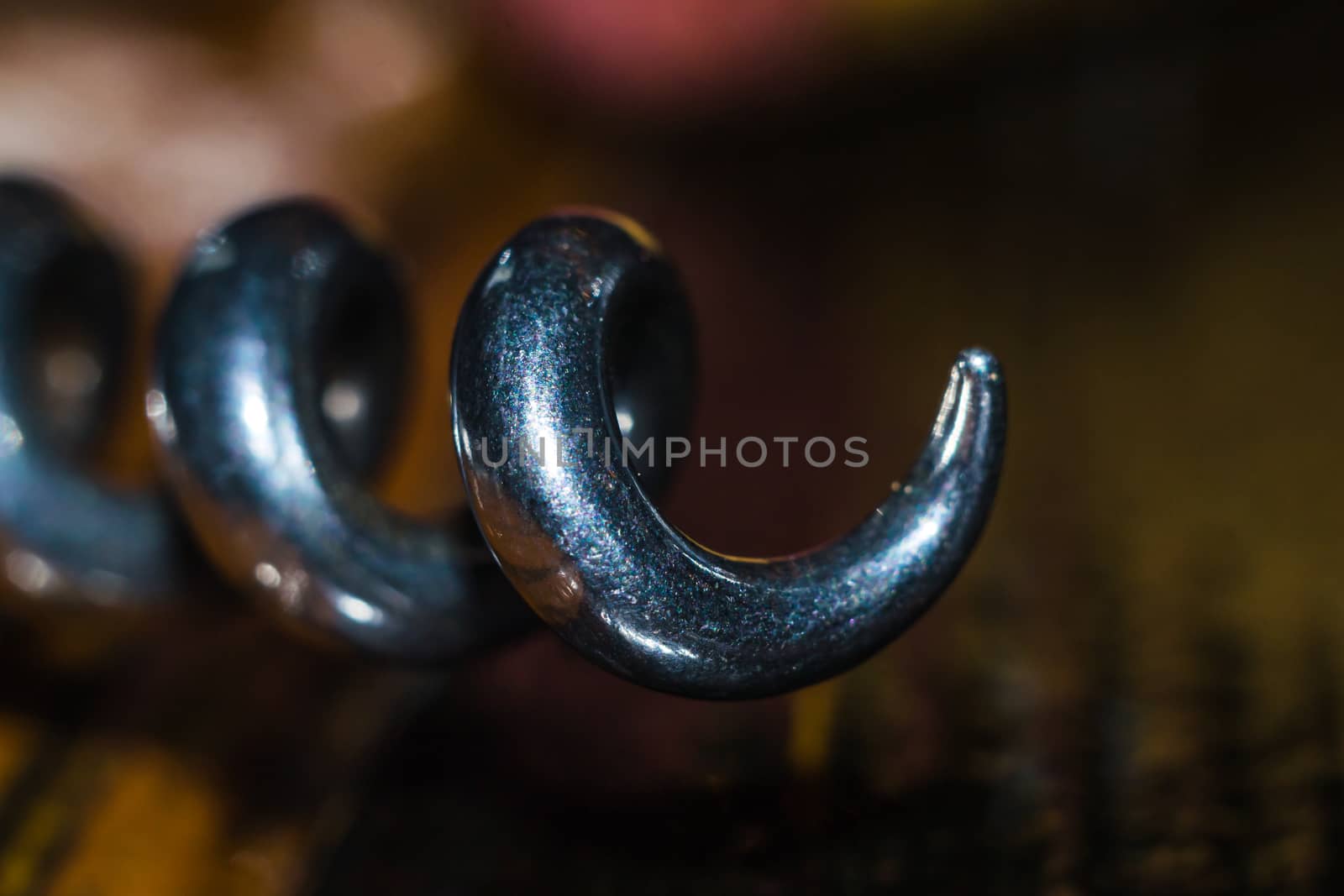 a corkscrew on a wooden table color glow bottle stopper wine