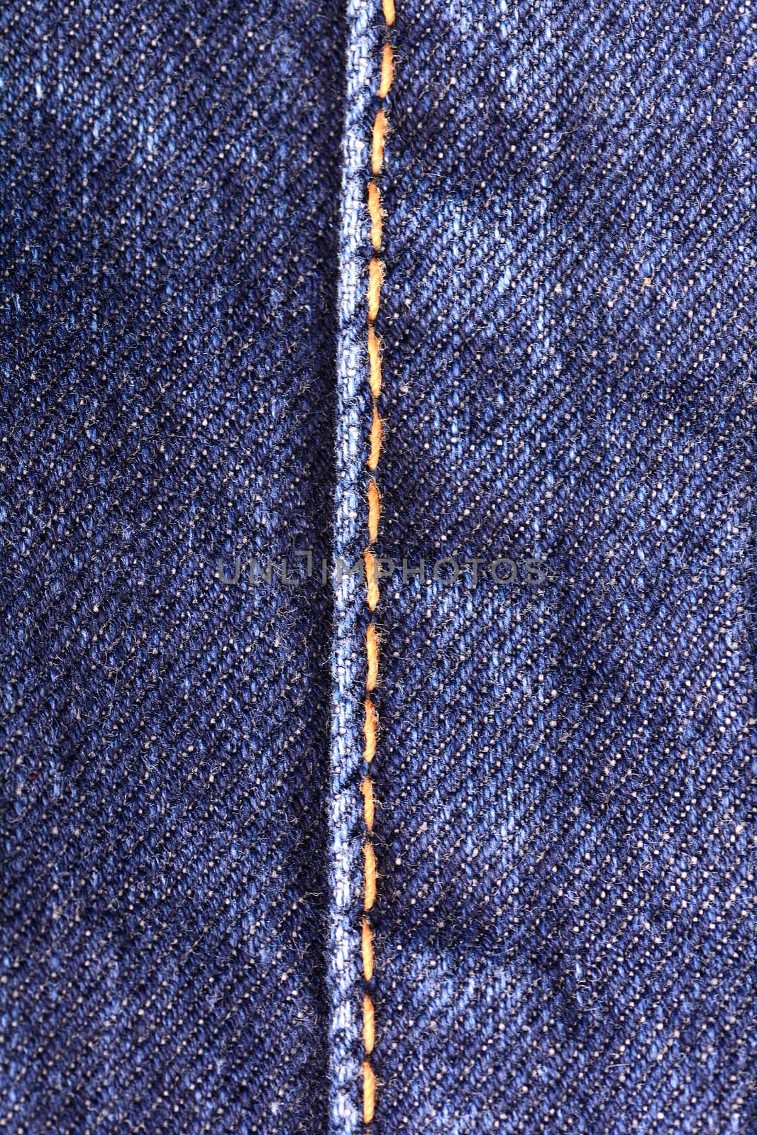 denim jeans background with seam of jeans fashion design. Old grunge vintage denim jean