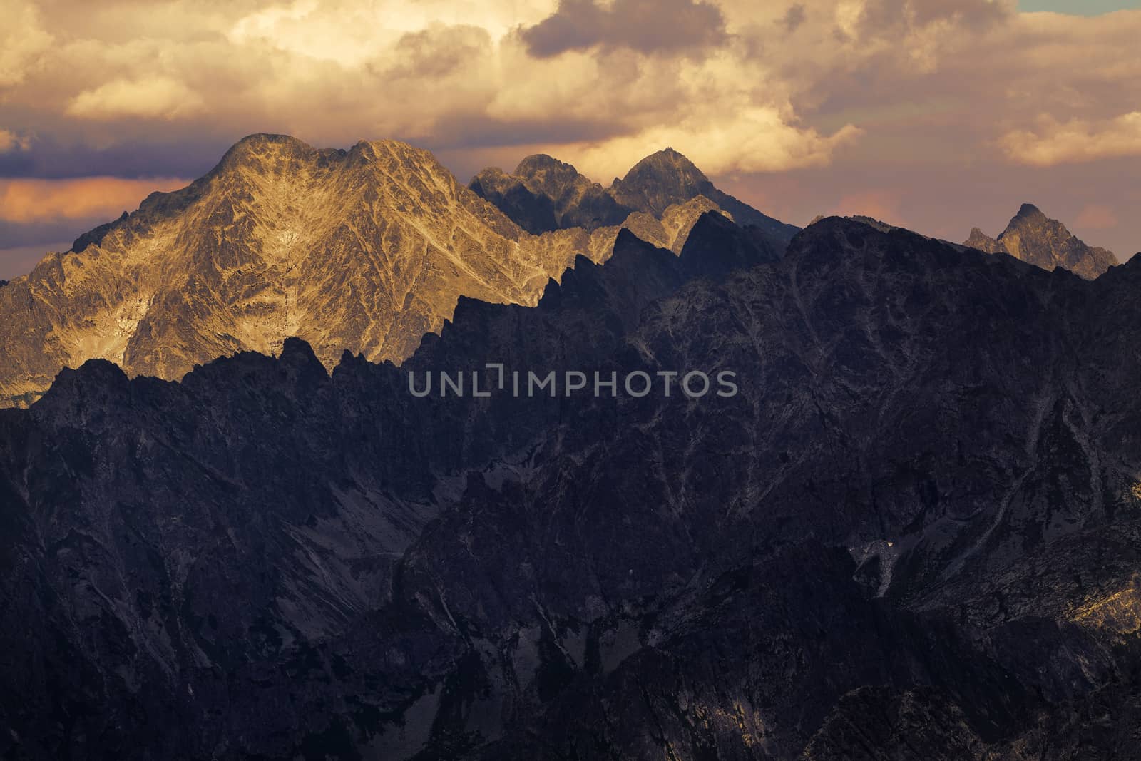 View on high rocky peak in Tatra Mountains. We can see Lomnicky Stit peak faf far awey