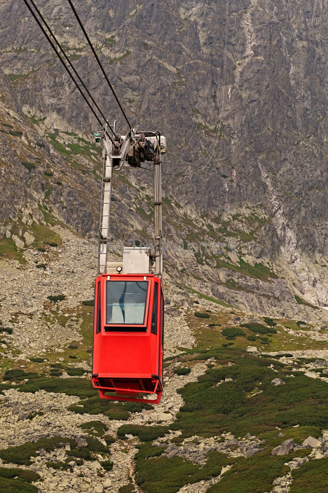 Wagon cable car against the background of beautiful rocky mountains by igor_stramyk