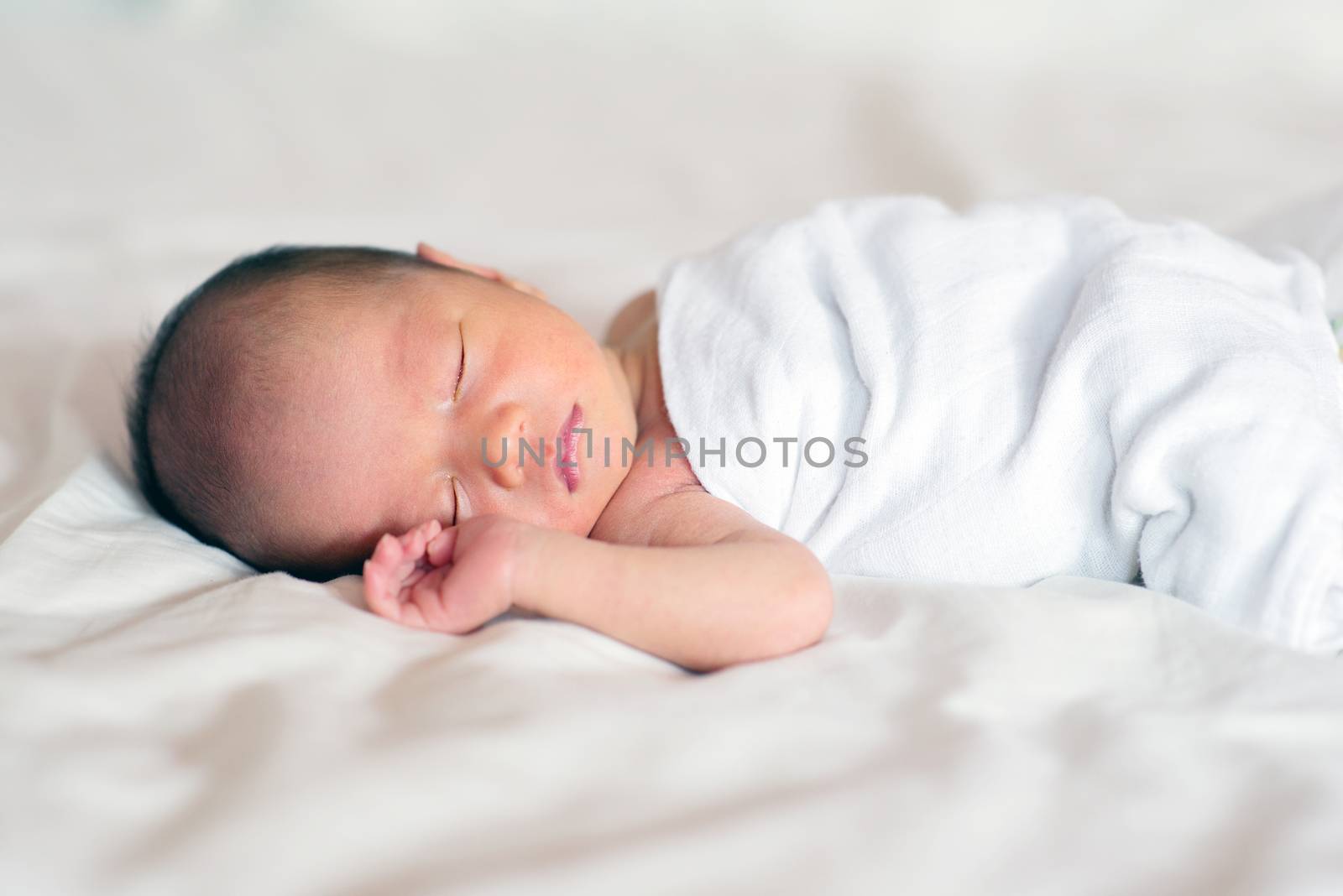 Asian newborn baby boy sleeping by szefei