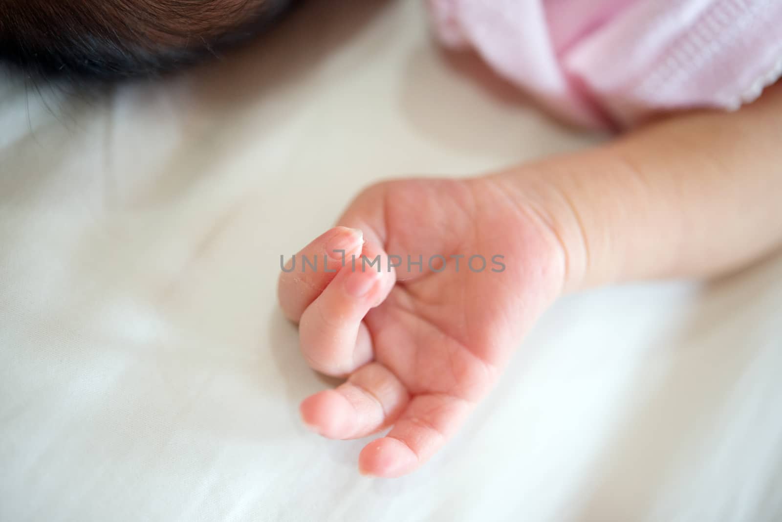 Newborn baby hand, close up.
