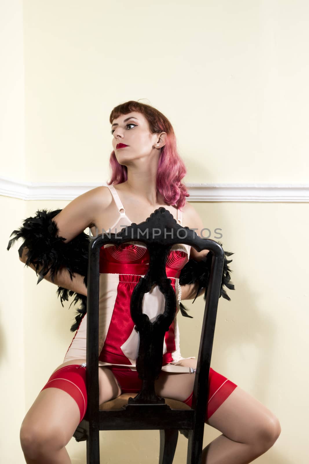 Girl with red vintage lingerie with classic chair.