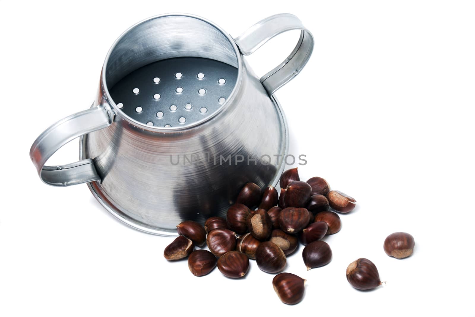 Close view of a metal rustic chestnut roaster isolated on a white background.