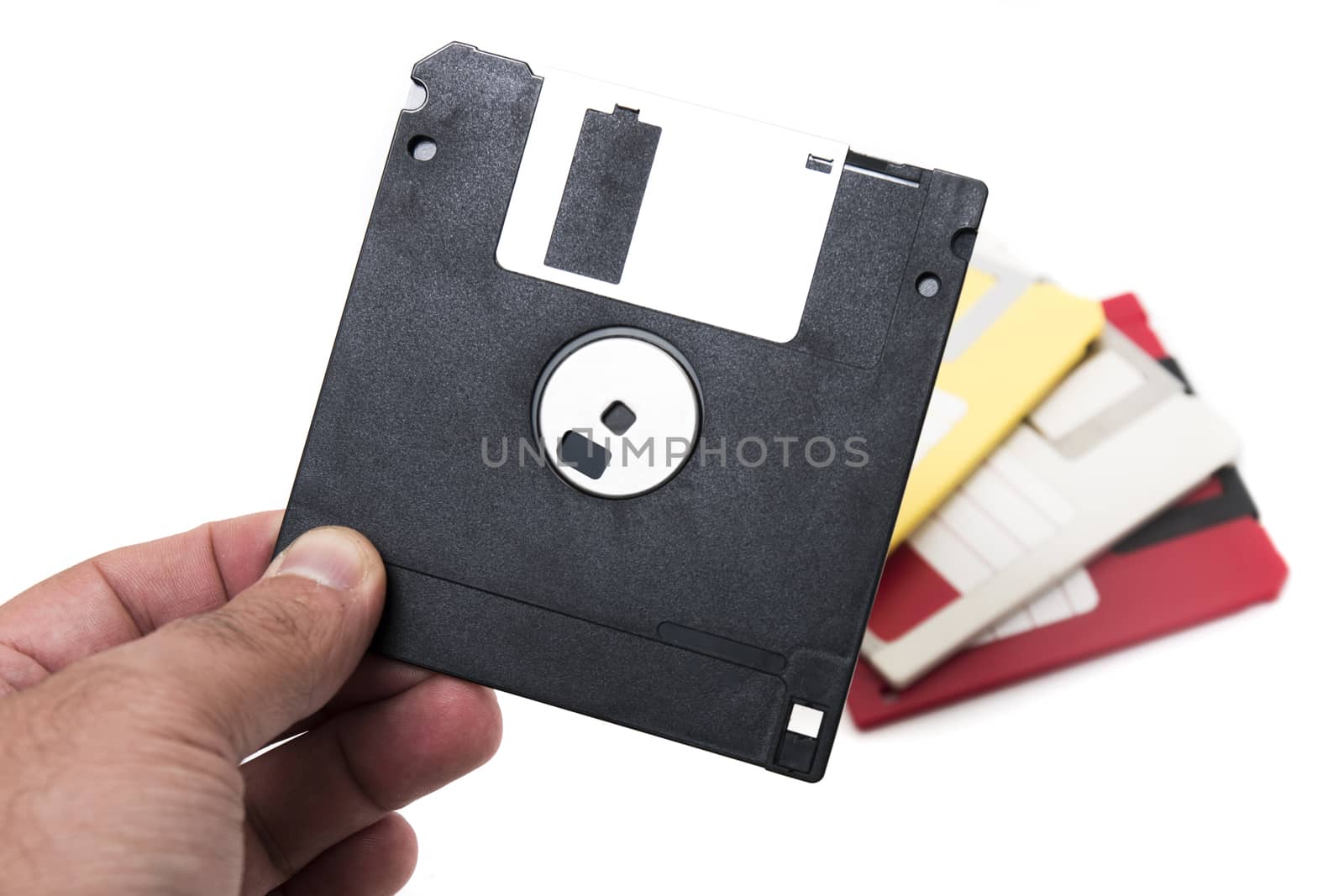 hand with floppy disk isolated on a white background.