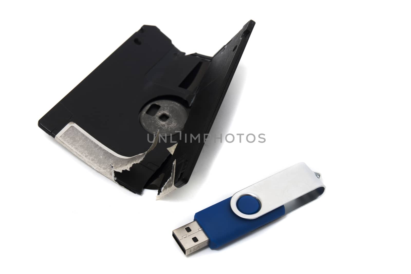 destroyed floppy disk and usb disk isolated on a white background.