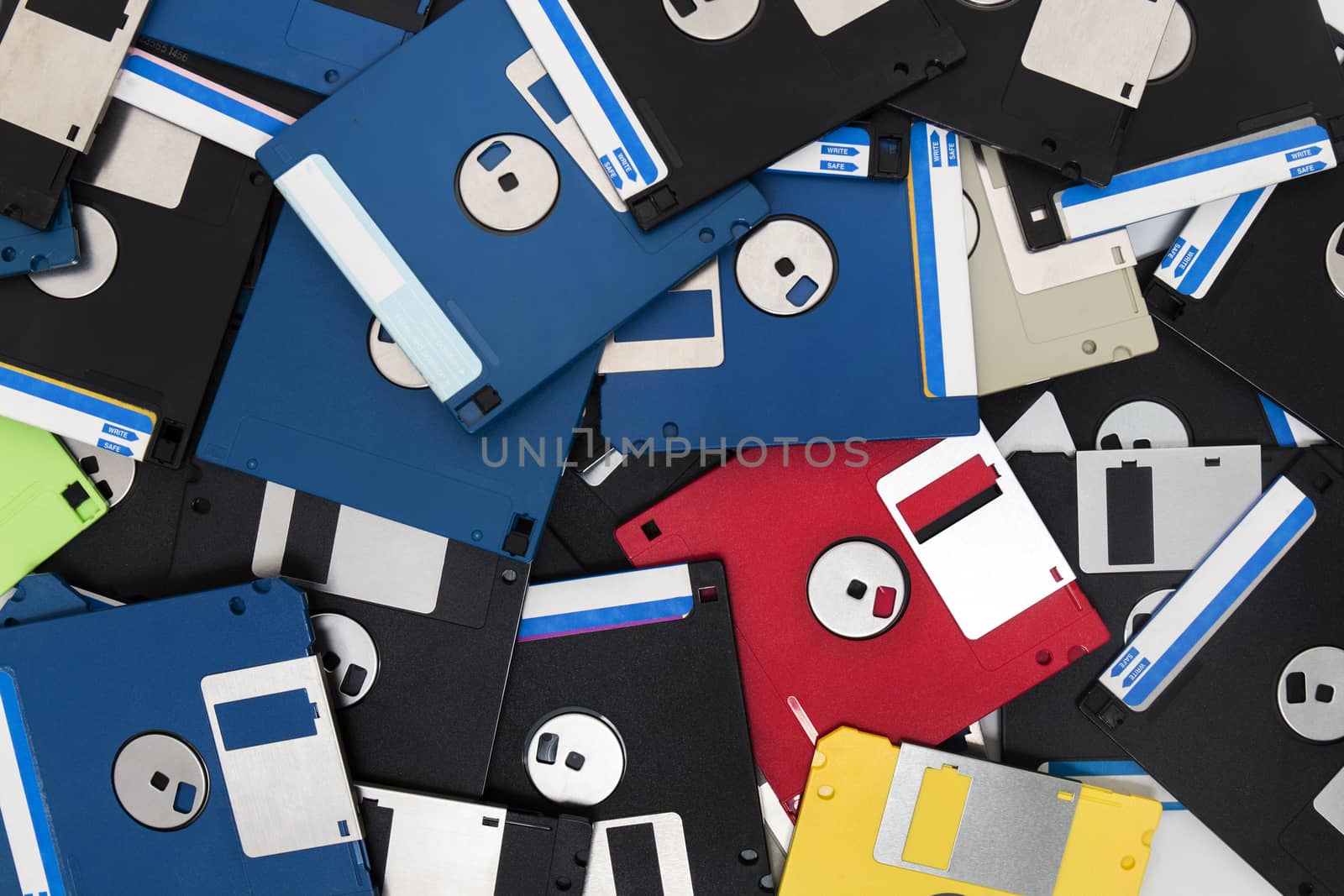 mixed pile of obselete computer floppy disks.