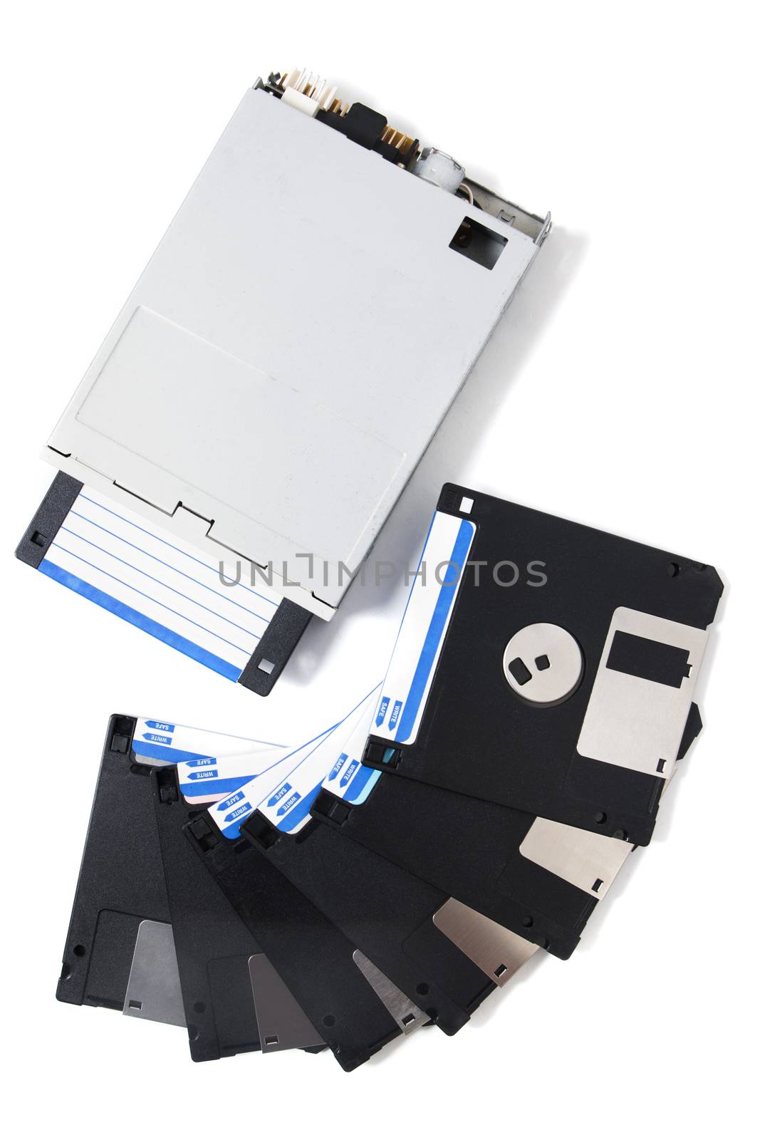 Closeup view of a computer floppy drive, isolated on a white background.