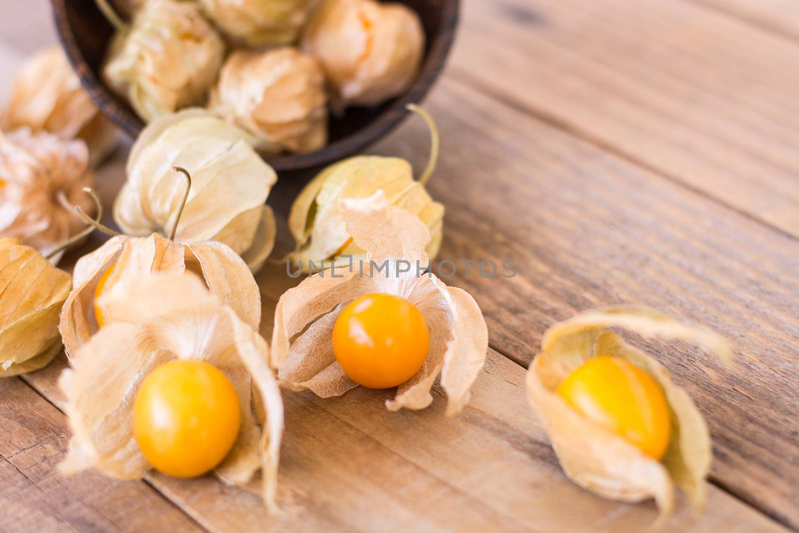 Cape gooseberry (Physalis) on old wooden, Healthy food